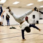 Hip Hop Breaking Students in Face Masks One-arm Hand Stand