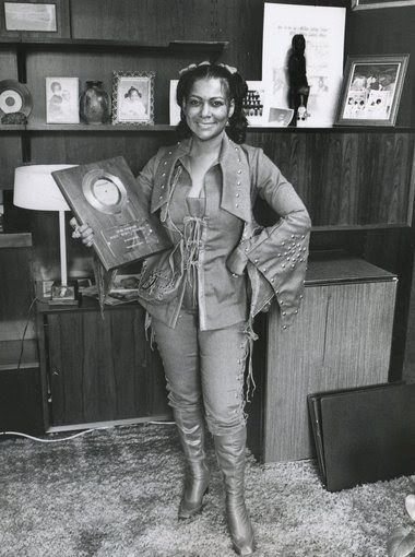 Sylvia Robinson holding record plaque